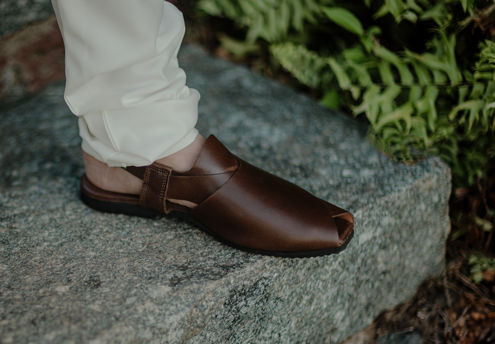 a brown wedding shoes with off white trousers