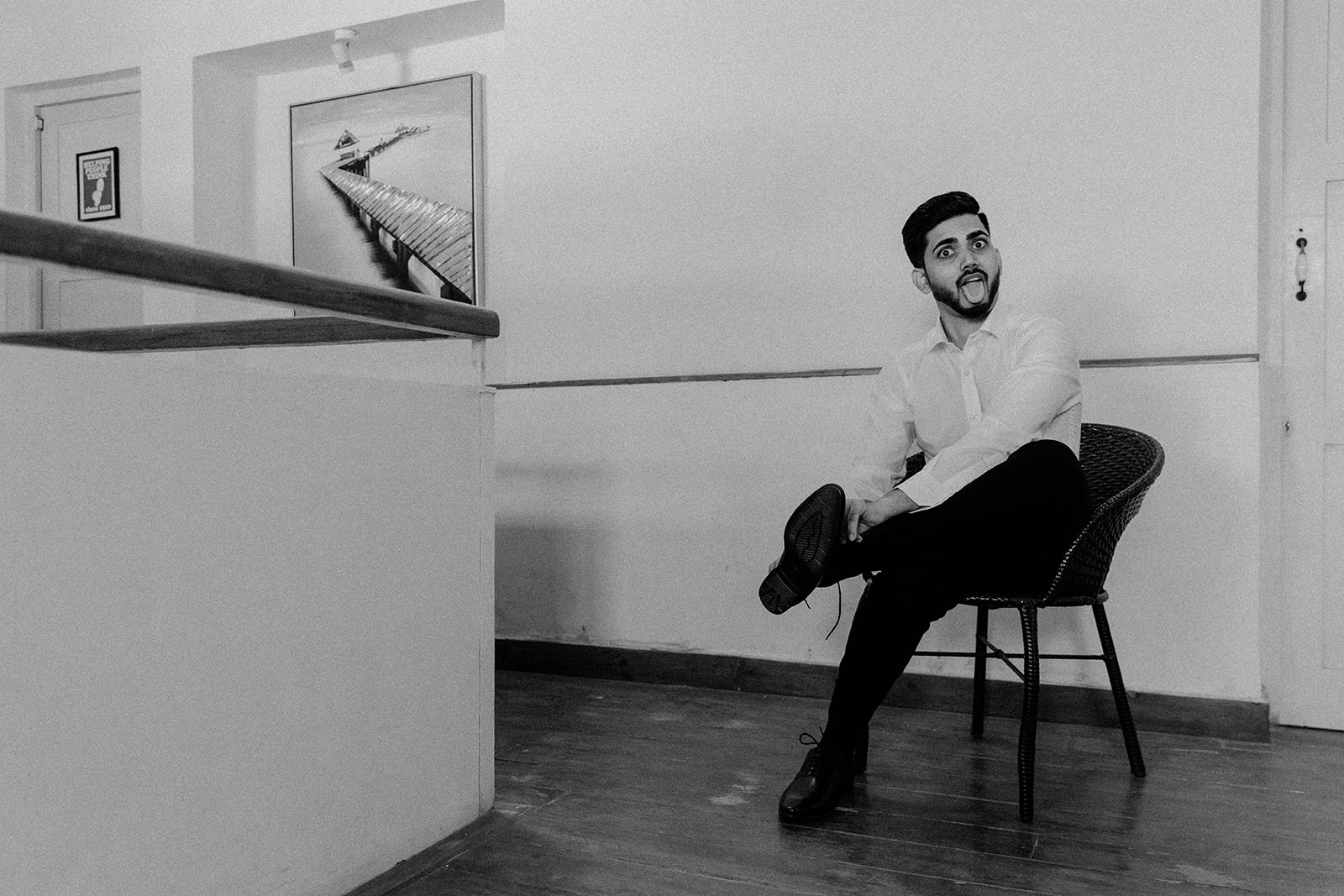 a photograph of a wedding photographer darius.n.fernandes with a goofy expression